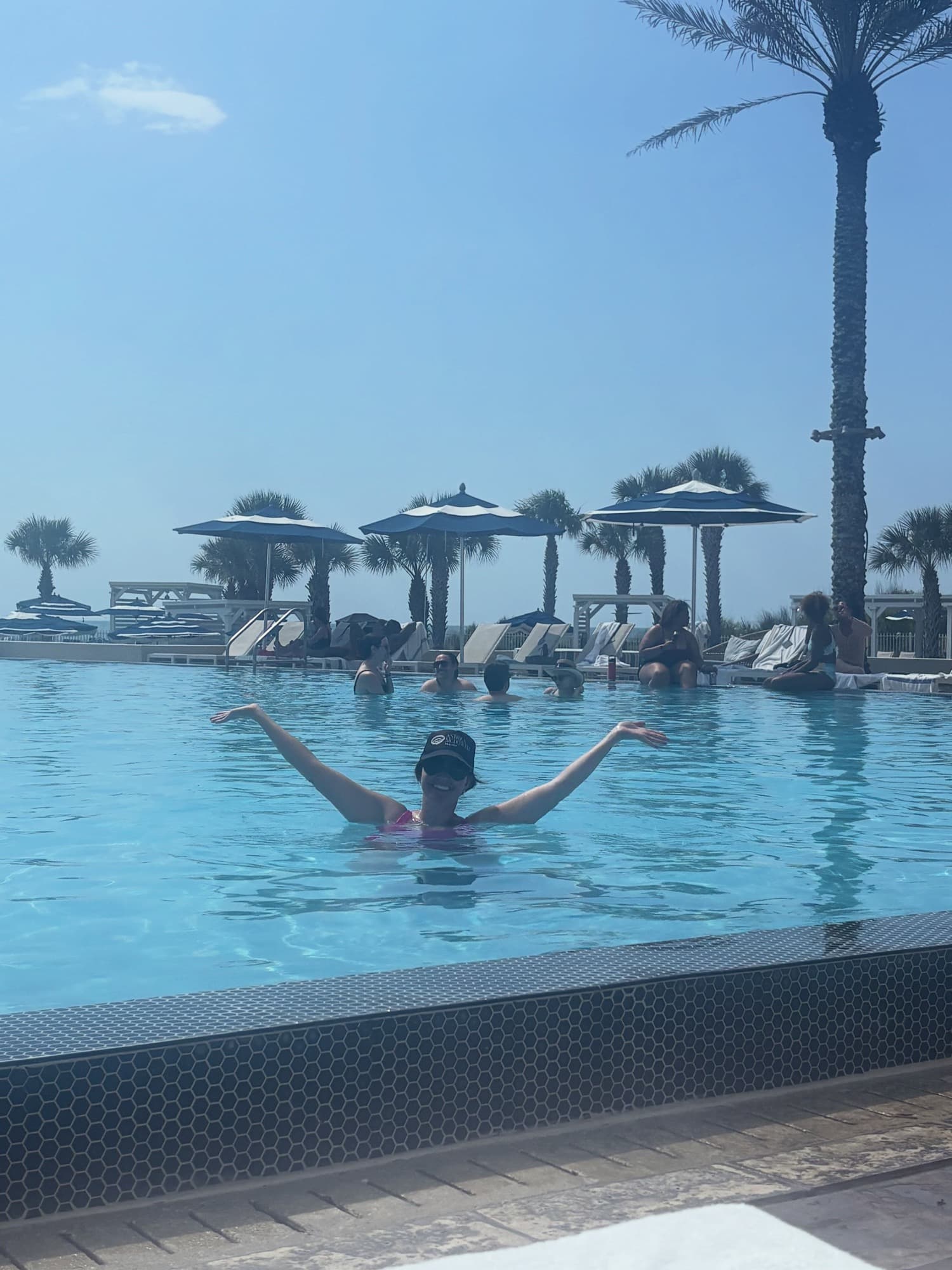 Andrea enjoying the coastal lifestyle at an Amelia Island resort pool